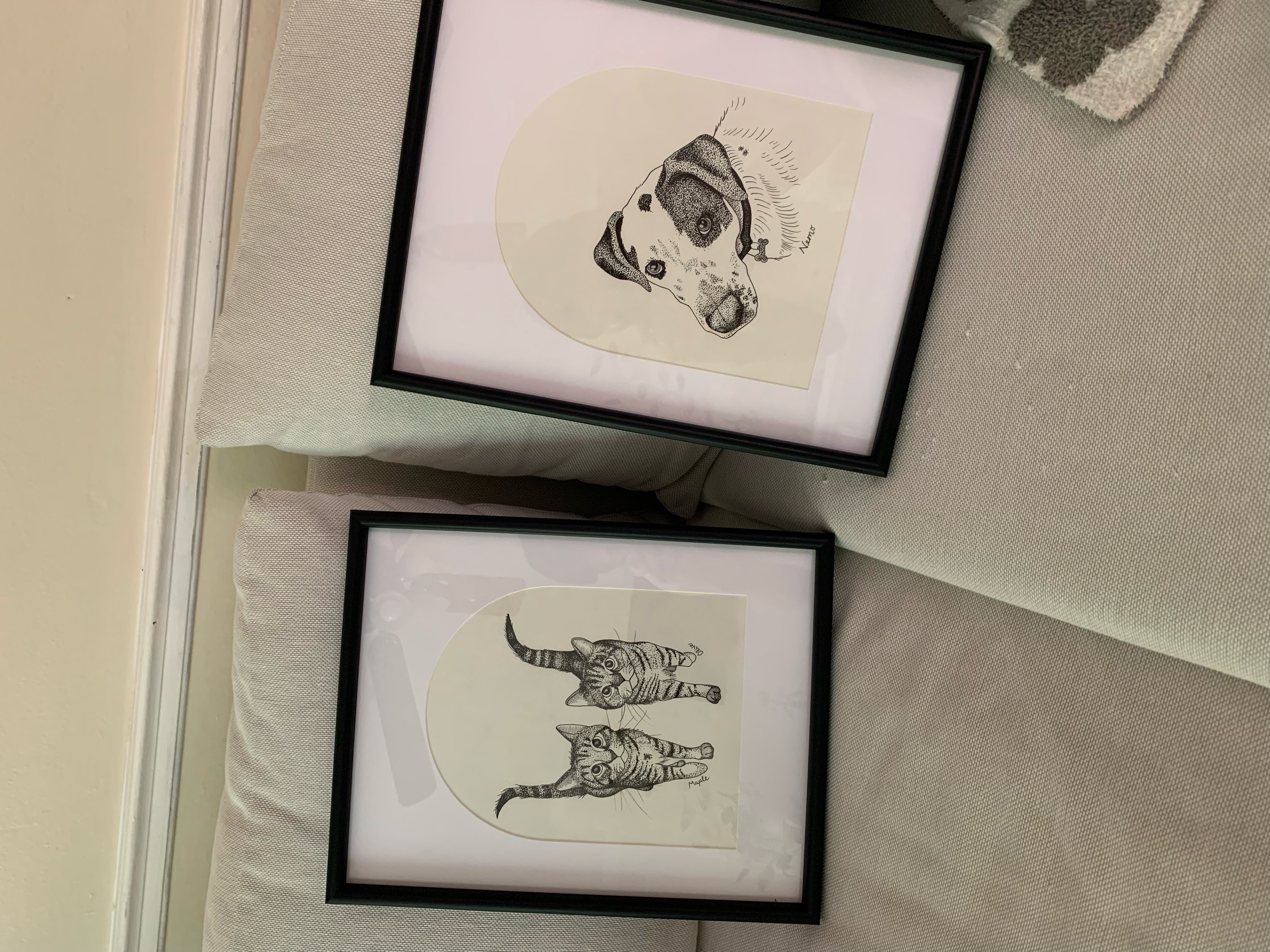 Two framed pen and ink pieces: a dog portrait and two kittens