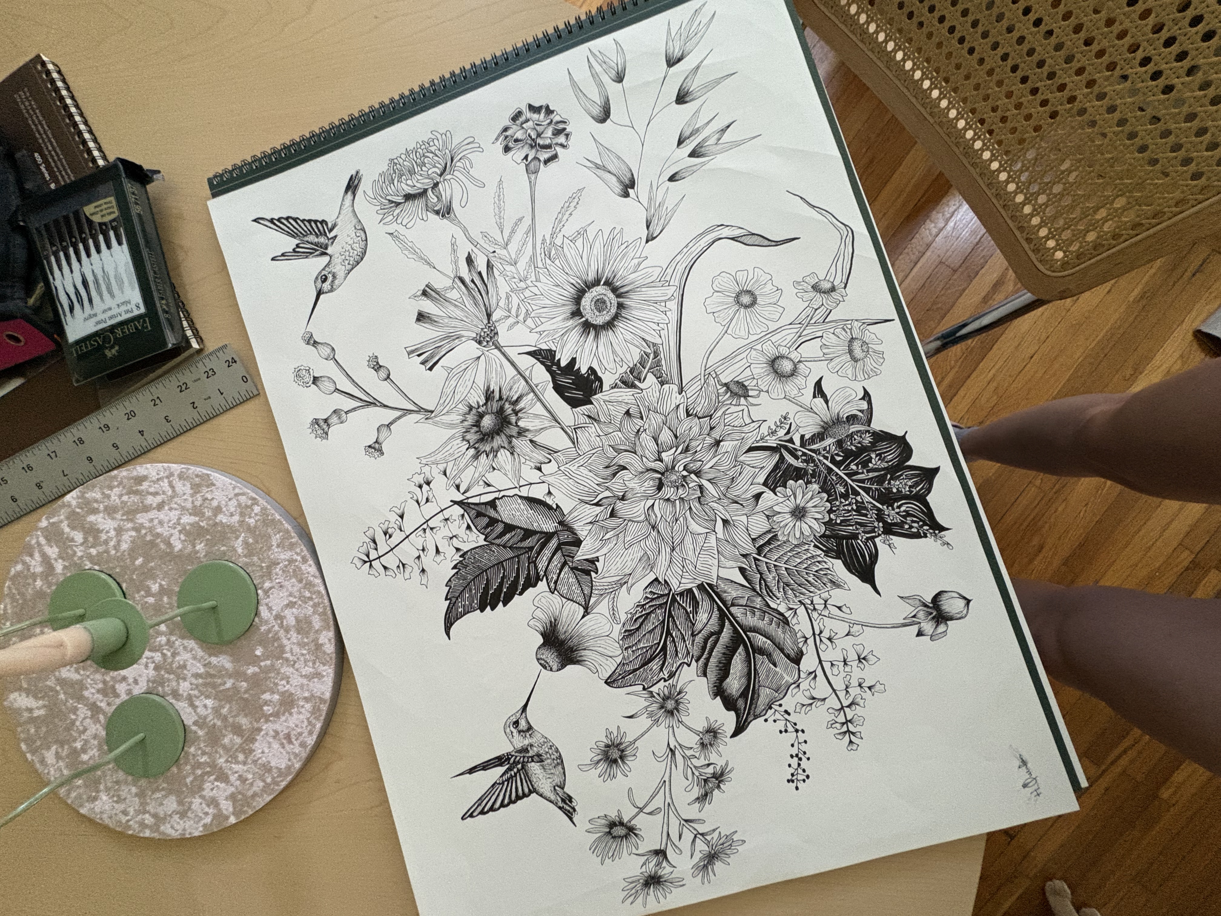 Detailed pen and ink botanical illustration with hummingbirds and flowers